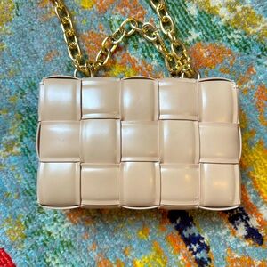 Beige purse with gold straps